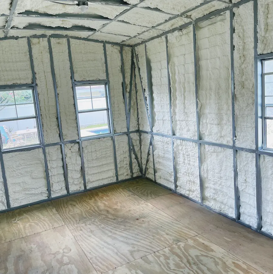 Closed-cell spray foam insulation applied to wall cavities in a residential project in Perth Amboy